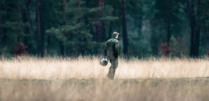 man standing in field