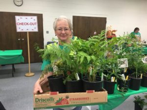 Extension Master Gardener Volunteer with plants