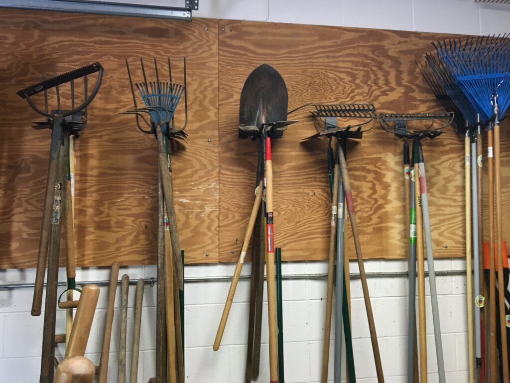 Garden tools hanging in garage