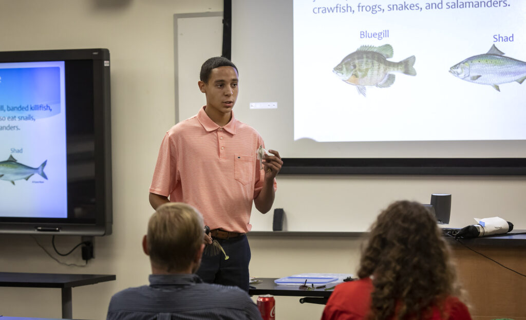 boy giving presentation