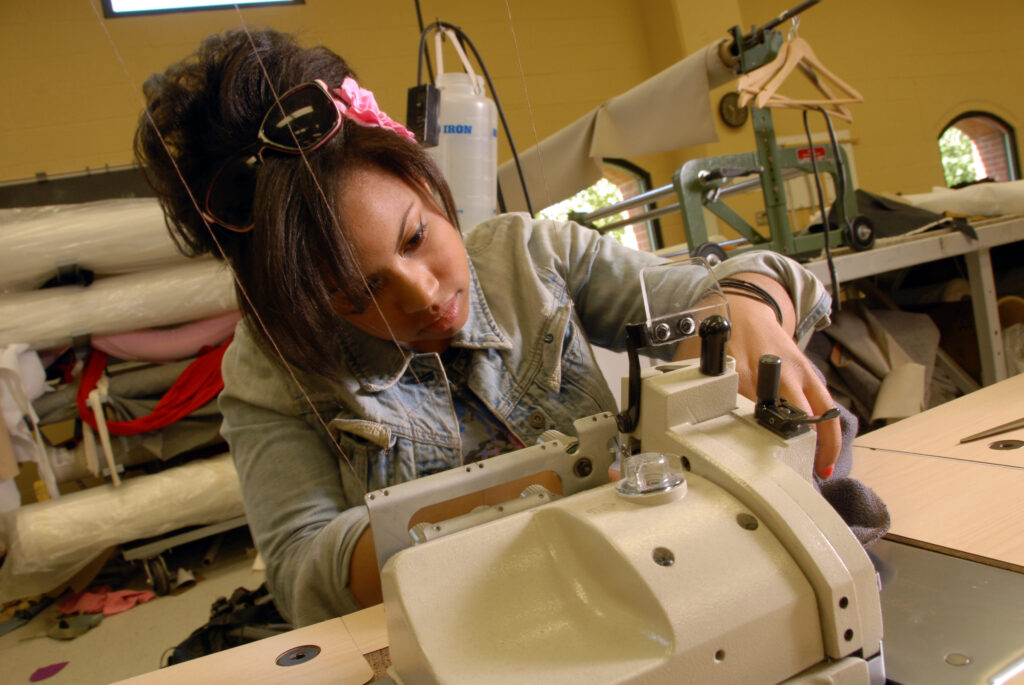 girl at sewing ma