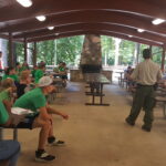 Forest Ranger talks to participating youth.