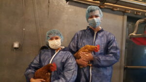 Two Forsyth County 4-H'ers hold hens.
