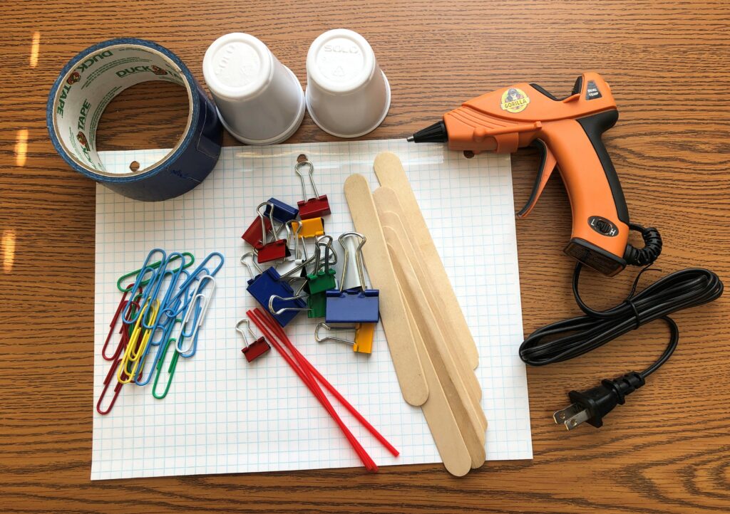 Craft supplies on a wooden table.