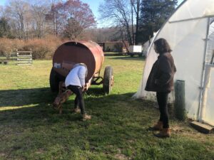 Women inspect a trailer. 