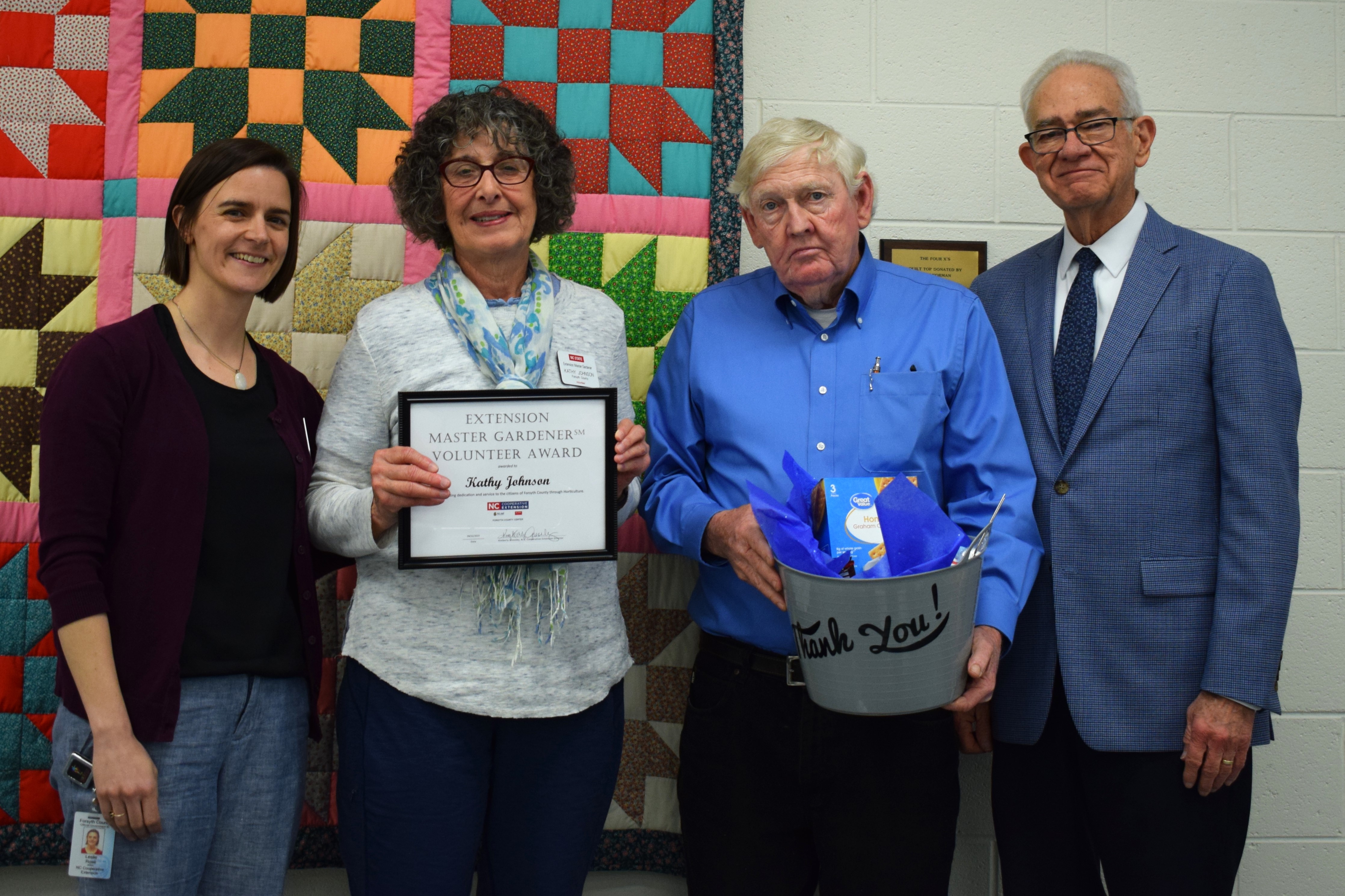 EMG Volunteer Award Recipient, Kathy Johnson with Horticulture Agent, Leslie Rose, and Forsyth County Commissioners Richard Linville and Dr. Don Martin