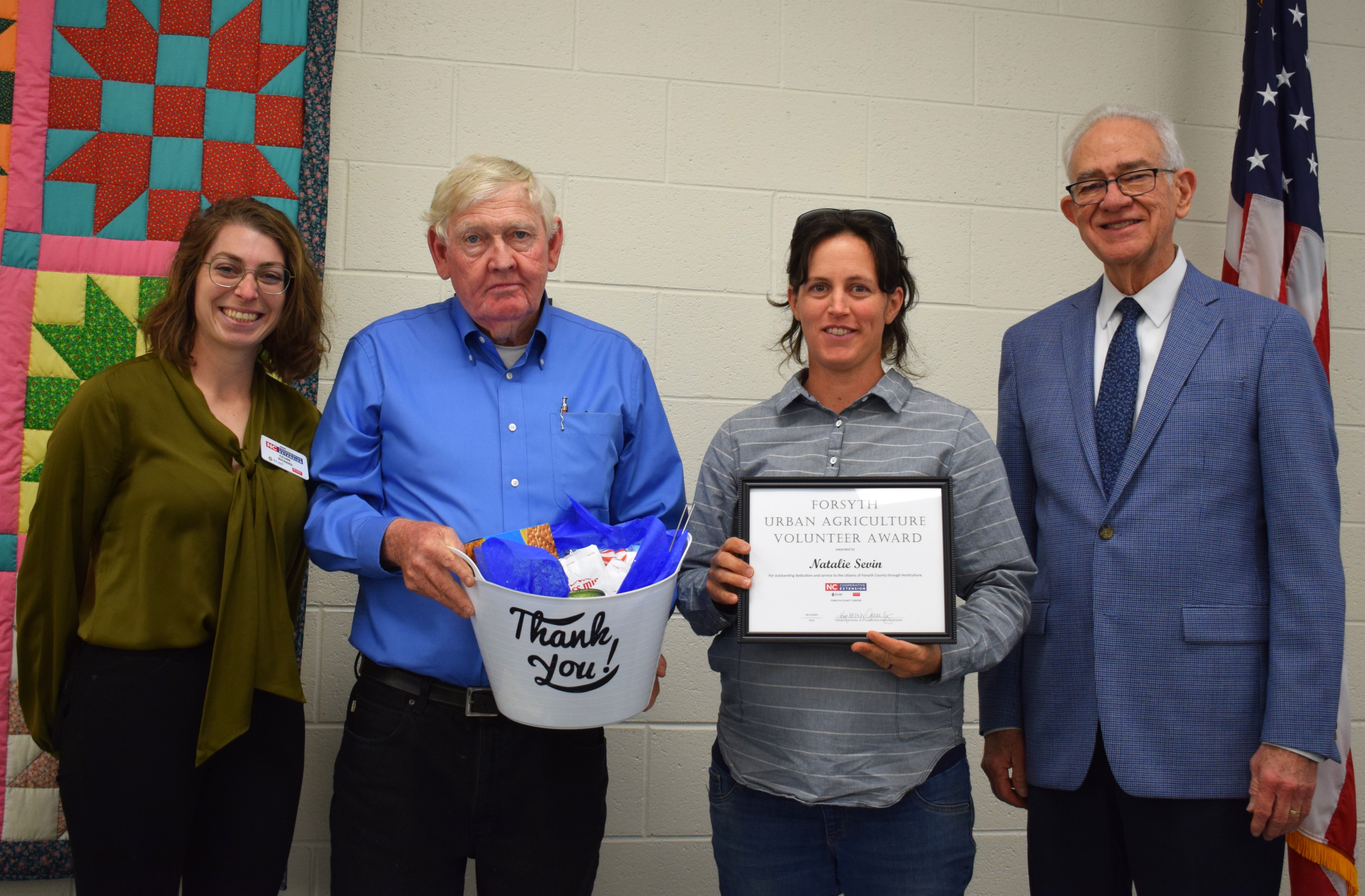 Urban Agriculture Volunteer Award, Natalie Sevin, with Horticulture Agent, Celine Richard, and Forsyth County Commissioners Richard Linville and Dr. Don Martin