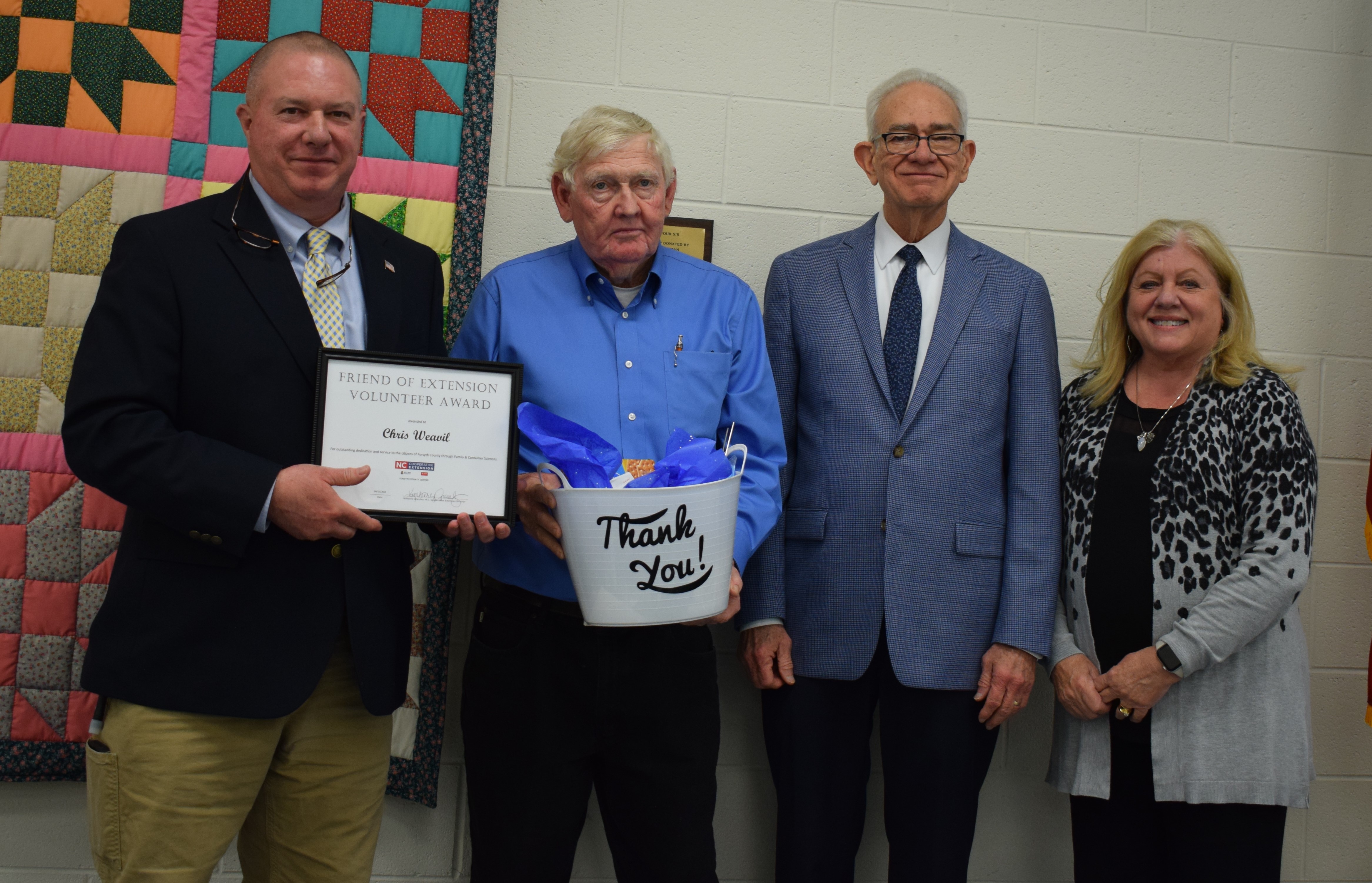 Friend of Extension Award Recipient, Chris Weavil with County Extension Director, Kim Gressley, and Forsyth County Commissioners Richard Linville and Dr. Don Martin