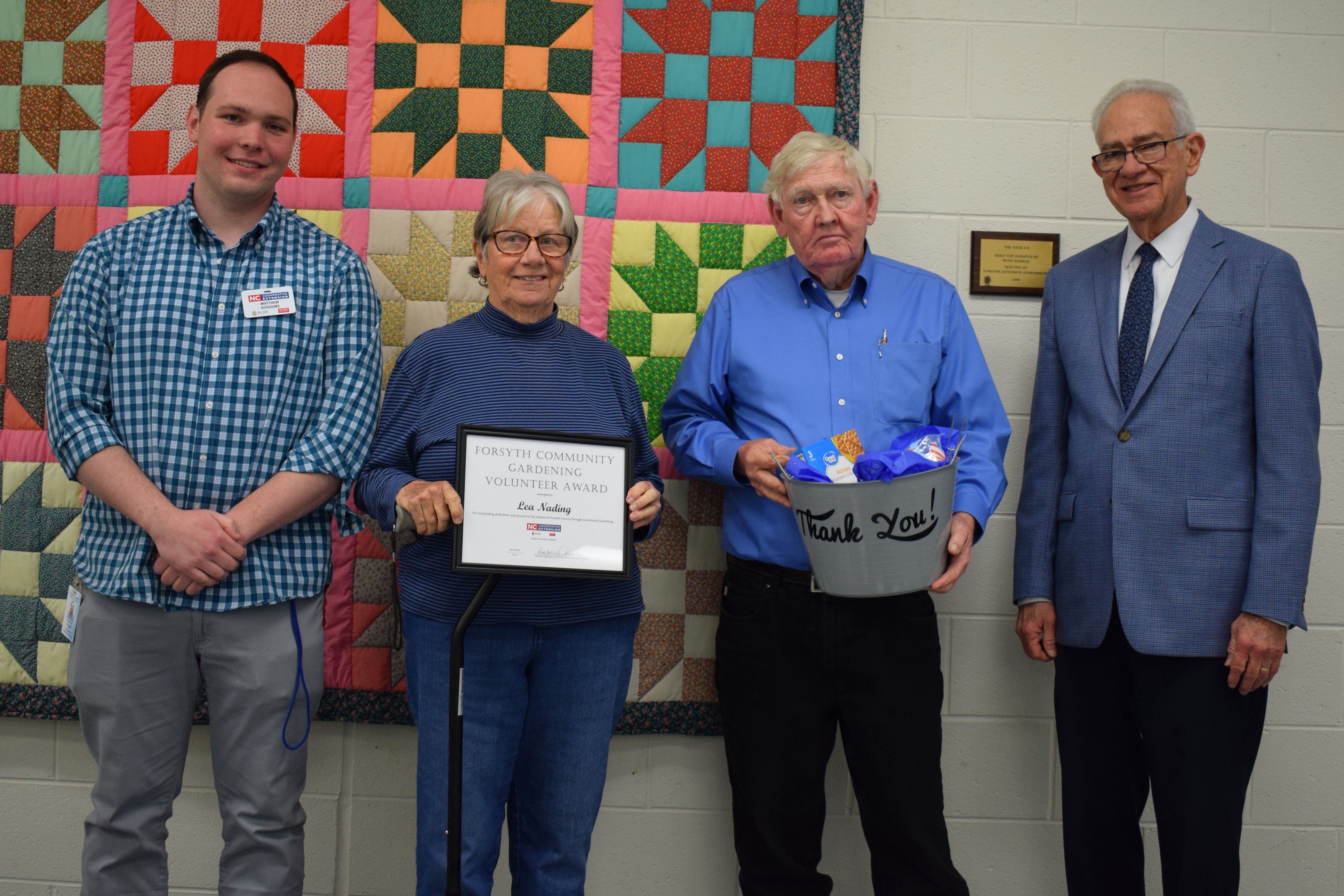 Community Gardening Volunteer Award Recipient, Lea Nading, with Community Gardening Coordinator, Matthew Scoggins, and Forsyth County Commissioners Richard Linville and Dr. Don Martin