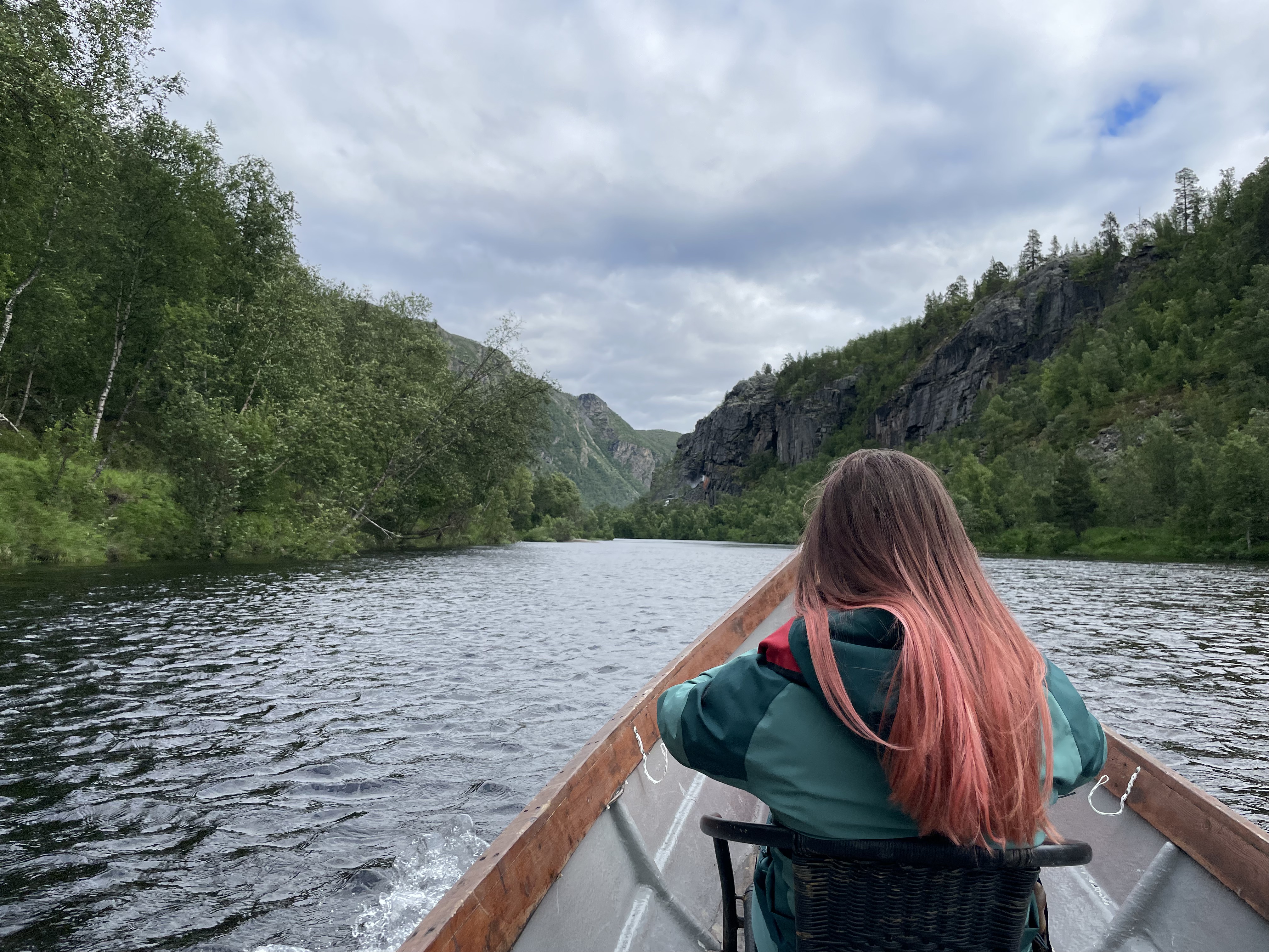 A picture taken in Norway by a 4-H Exchangee from the river with the mountains in the background.