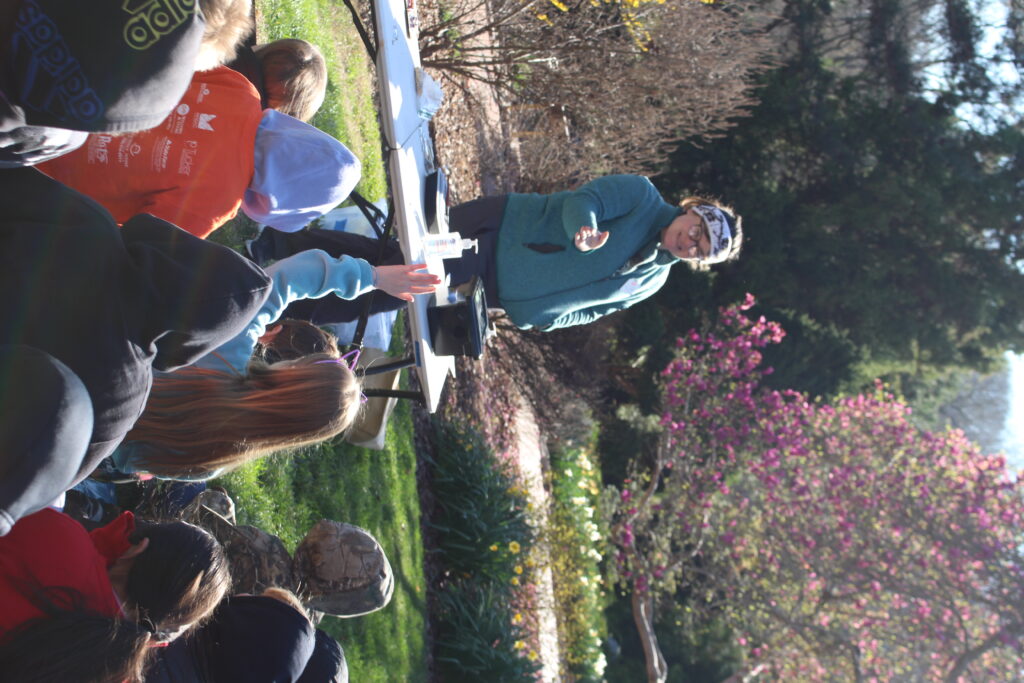 Instructor talking to students in outdoor lesson