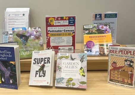 Image of display about Pollinators. Display includes book recommendations and a flyer about the Great Southeast Pollinator Census. Display is housed at the Paddison Memorial Branch Library in Kernersville.
